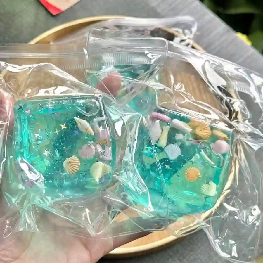 Ocean ice cube squishy transparent slow rising sensory fidget toy with sea animals and glitter UK