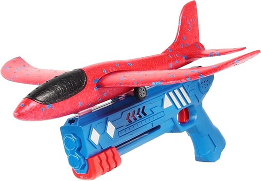 A red and blue toy airplane launcher with a red foam airplane attached. The launcher is shaped like a gun and has a trigger. The airplane has wings and a propeller.